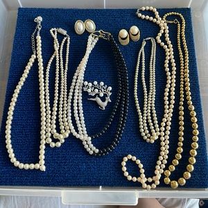 6 necklaces, 2 sets of earrings and a brooch